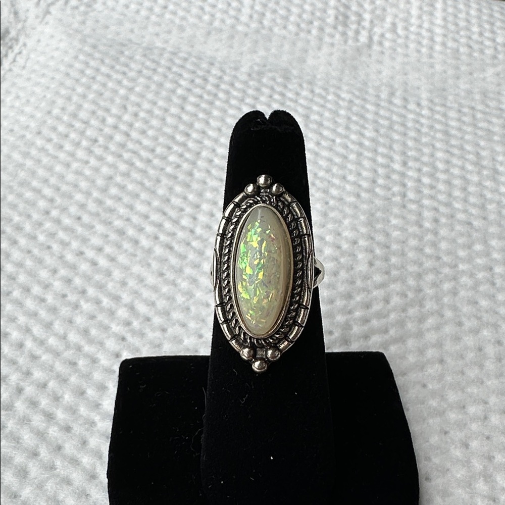 Antiqued silver simulated opal ring. Size 6. Very nice looking.
